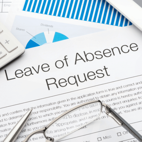 Employee leave of absence request on desk for Americans with Disabilities Act reasonable accommodation