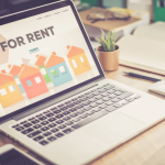 First-time renter searching for rent listings on laptop