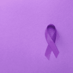 Purple ribbon on purple background for Walk to End Alzheimer's