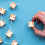 Employee wooden blocks on blue background connected by labor union